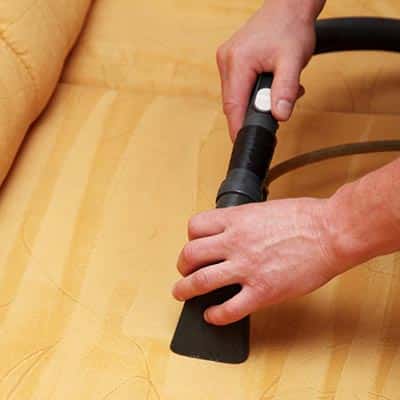 Professional cleaning of the upholstery on a sofa